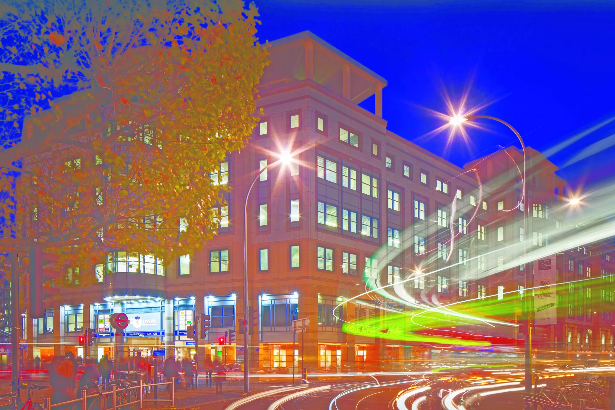 Night view of the external building on busy street with light movement