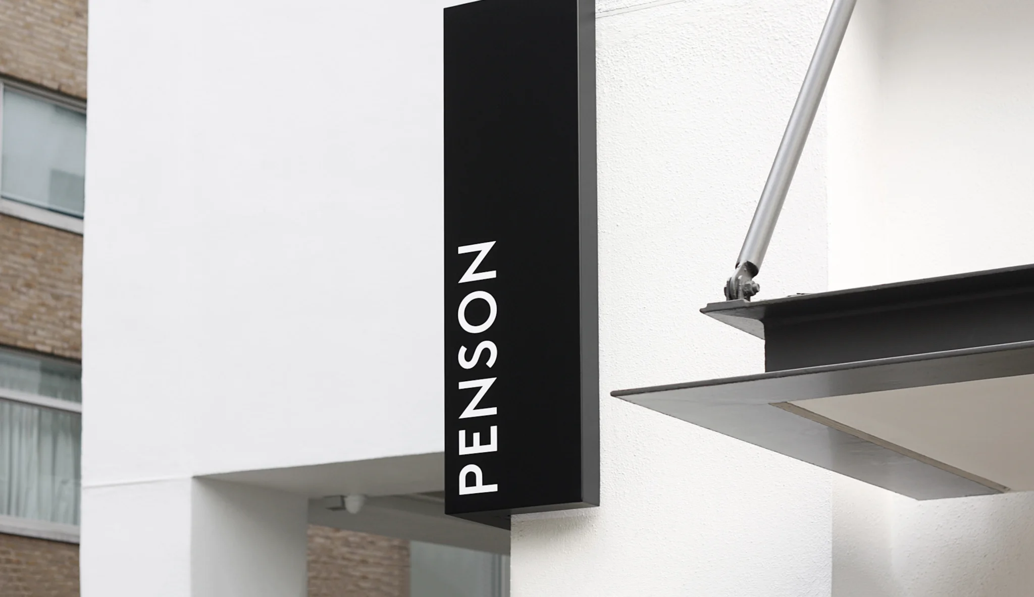 Penson studio sign on the corner of their office building