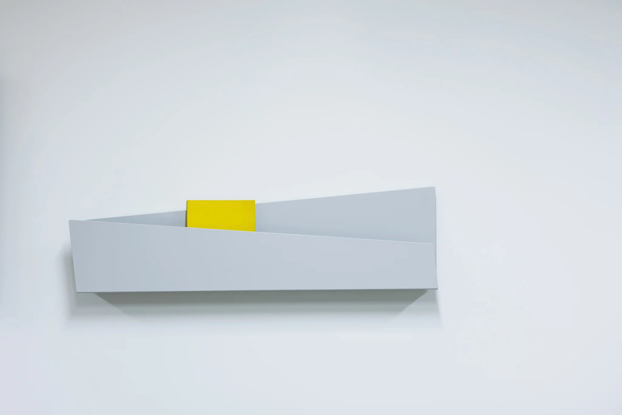 White sculptural wall magazine  holder