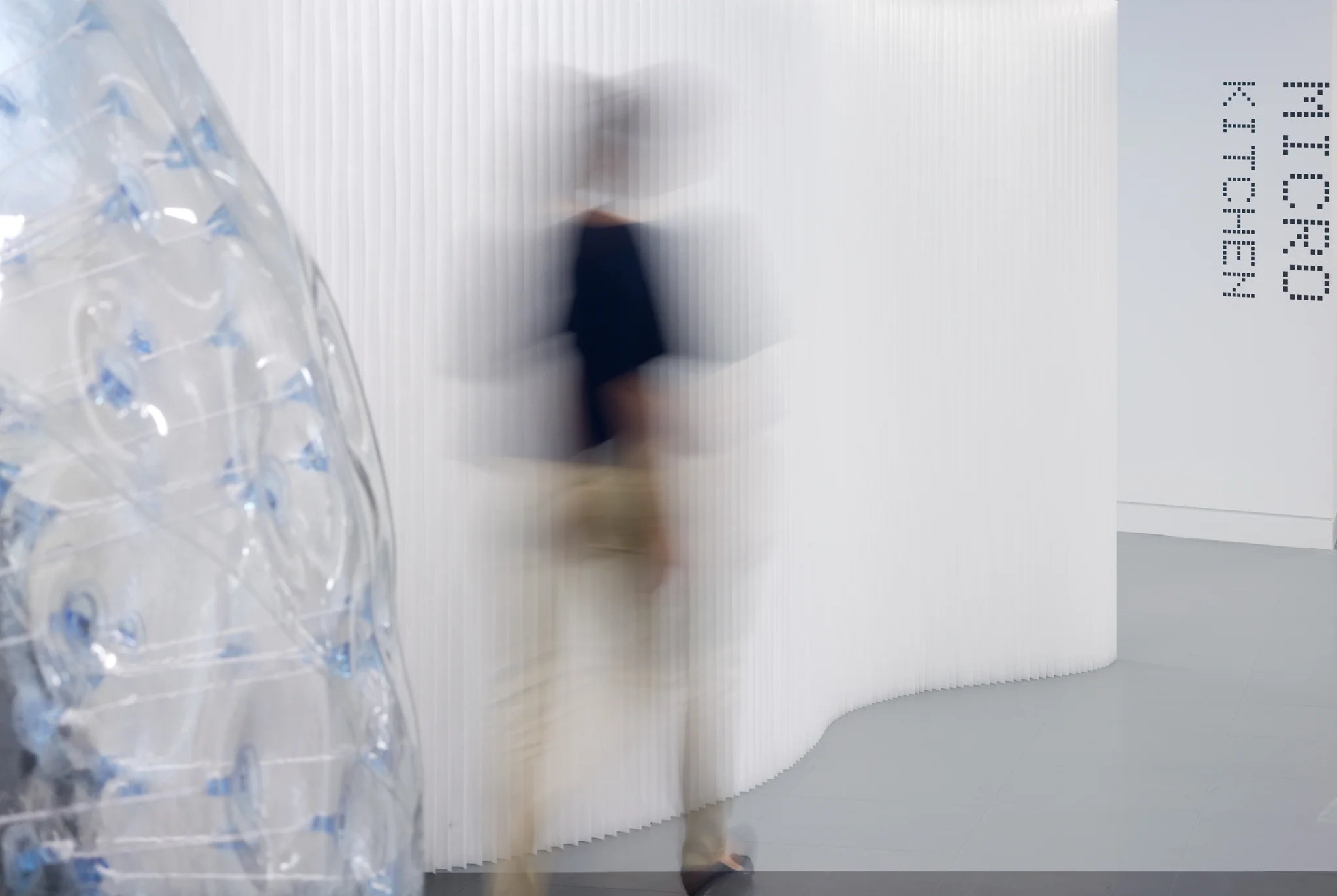 person walking away from an inflatable pod