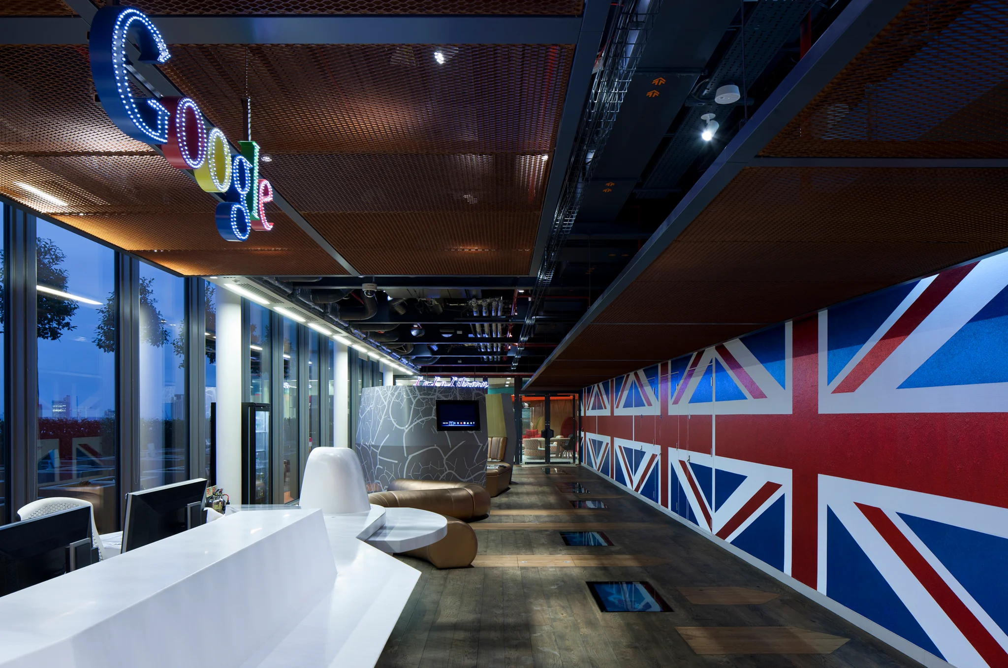 Google reception with a union jack wall and suspended google logo sign