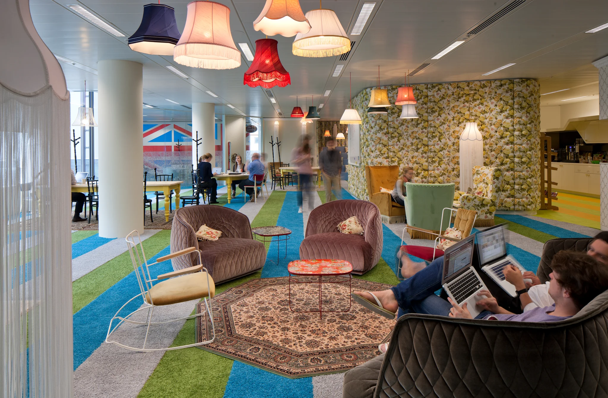eclectic seating area with a kitsch theme & furniture and floral wall paper