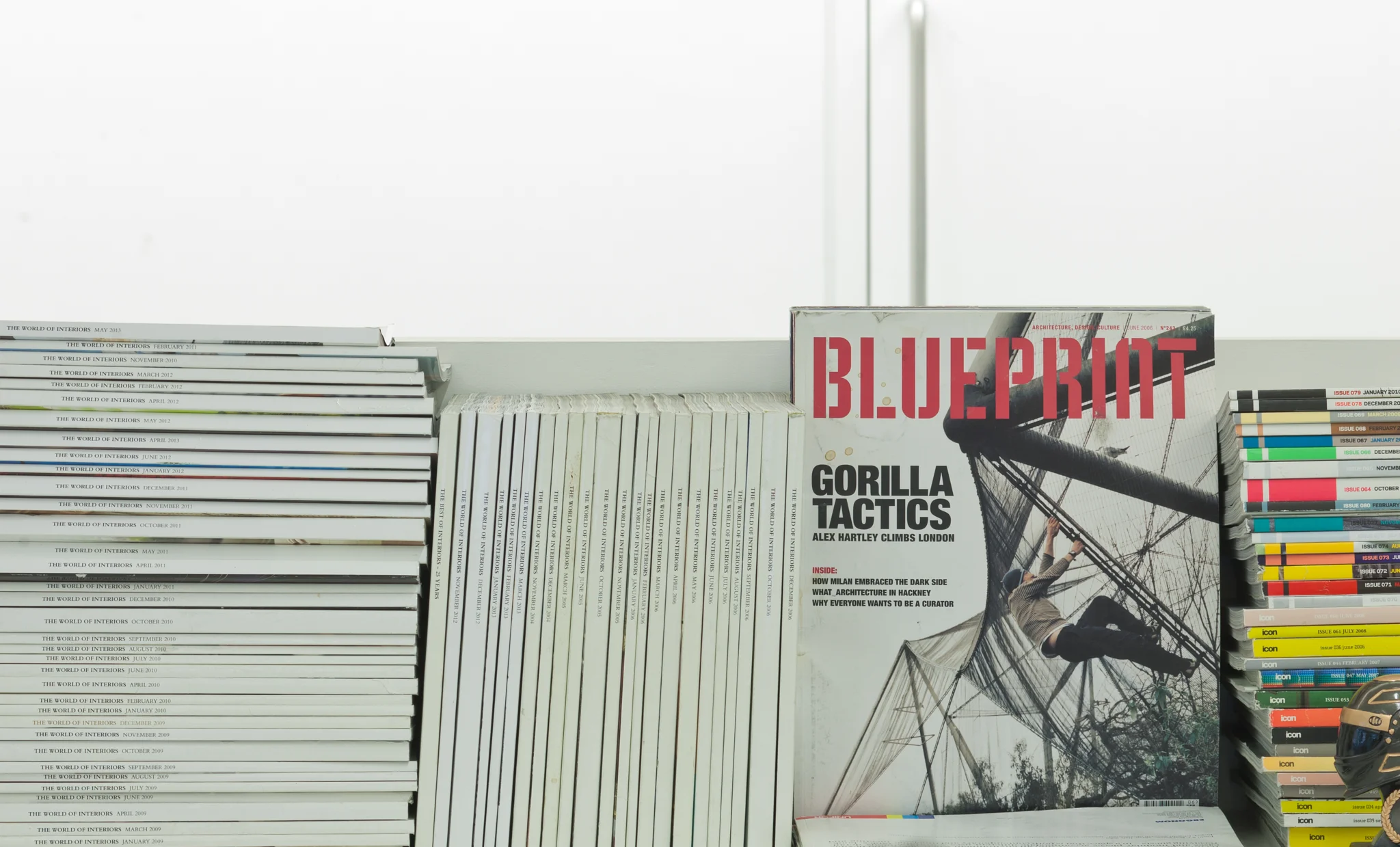 stacks of design magazines on a shelf