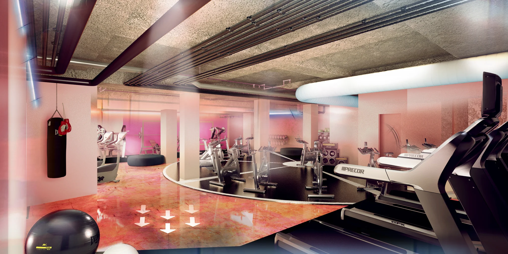 粉红色的健身房，有健身器材和斑驳的棕色和粉红色光面地板