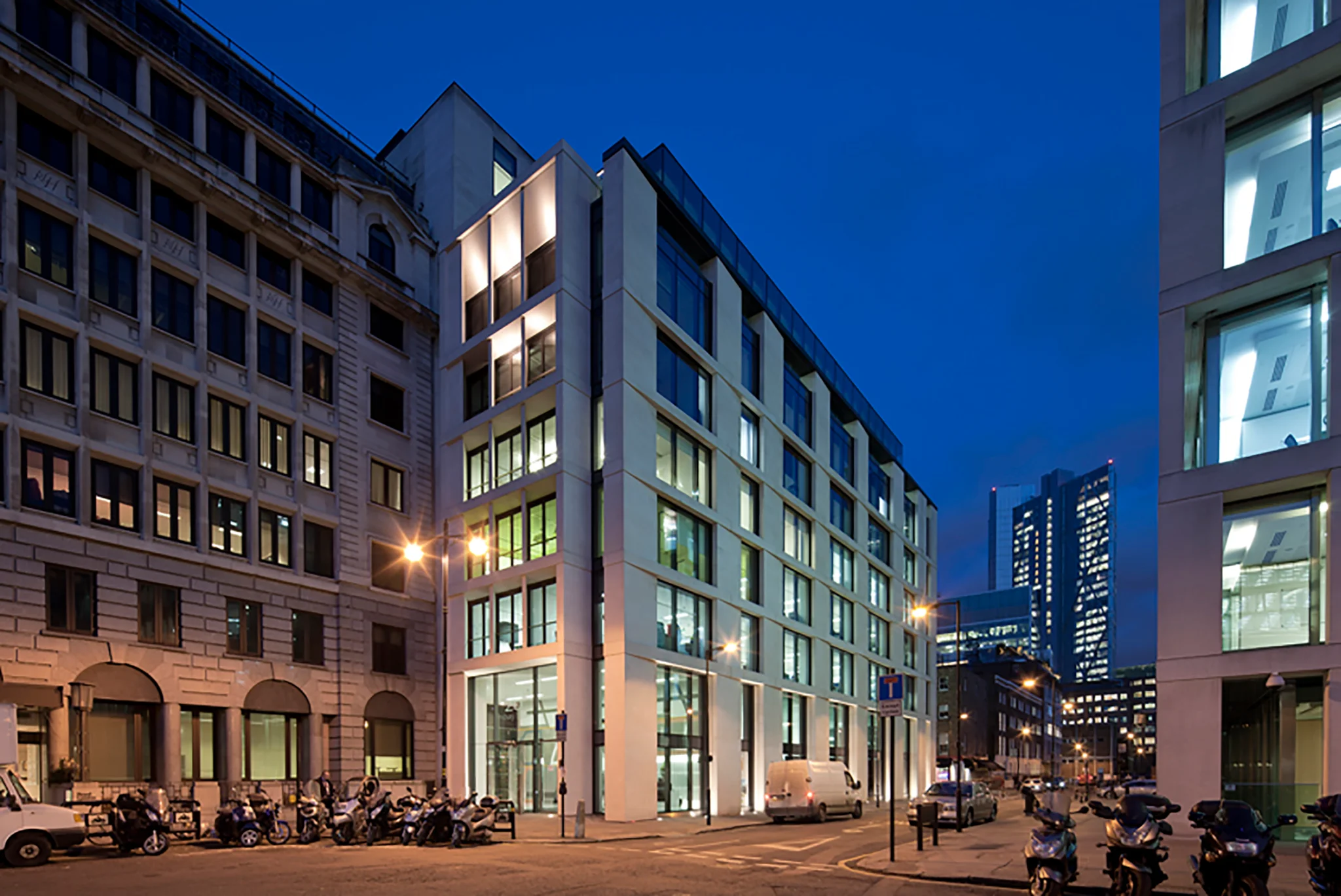 an exterior shot of the corner of Co-Work Finsbury Square from a busy street at night