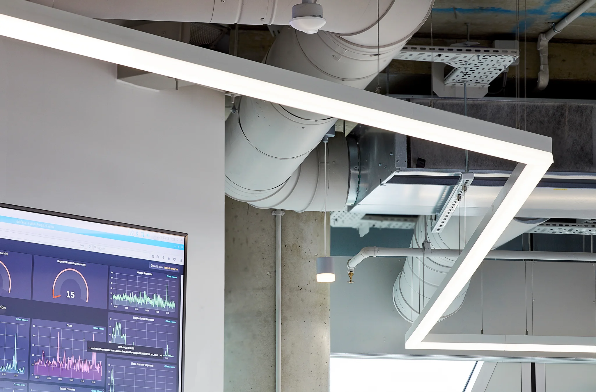Detail shot of white zig zag LED light and corner of TV screen showing data