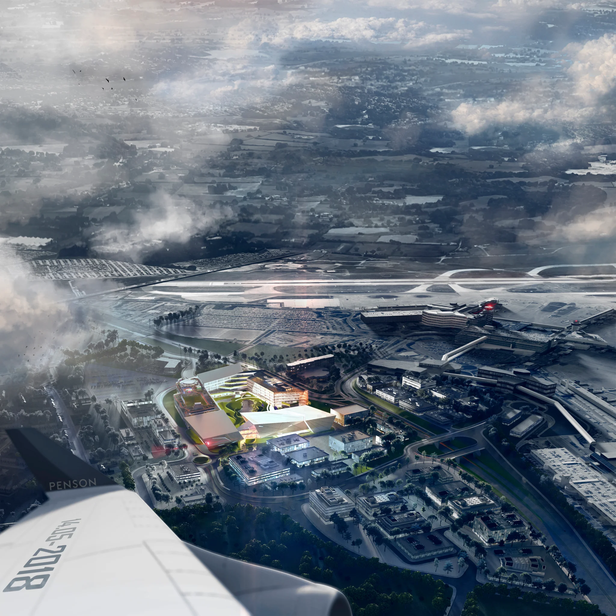 An illuminated aerial view off the wing of a plane of The Hut Group Campus in Manchester