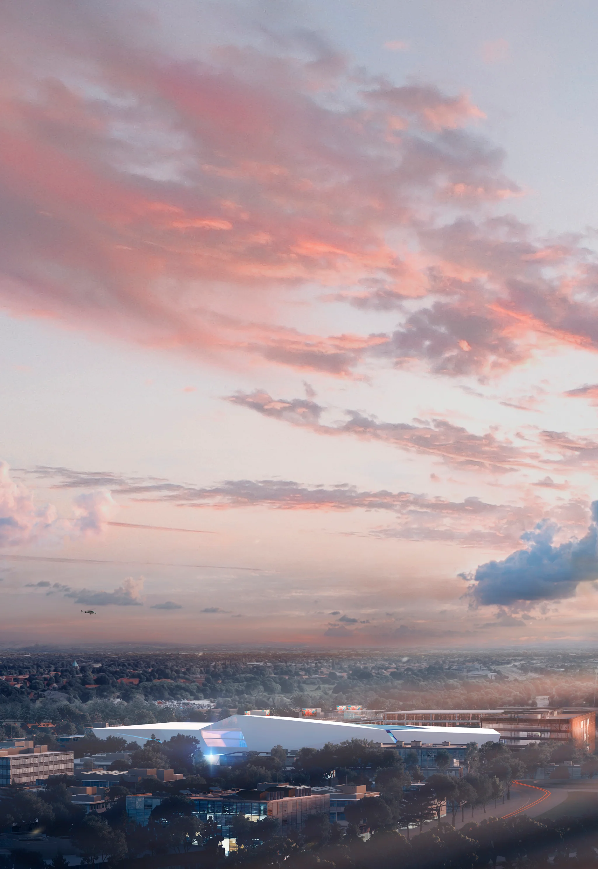 An illuminated aerial view of The Hut Group Campus in Manchester at dawn - with pink sky