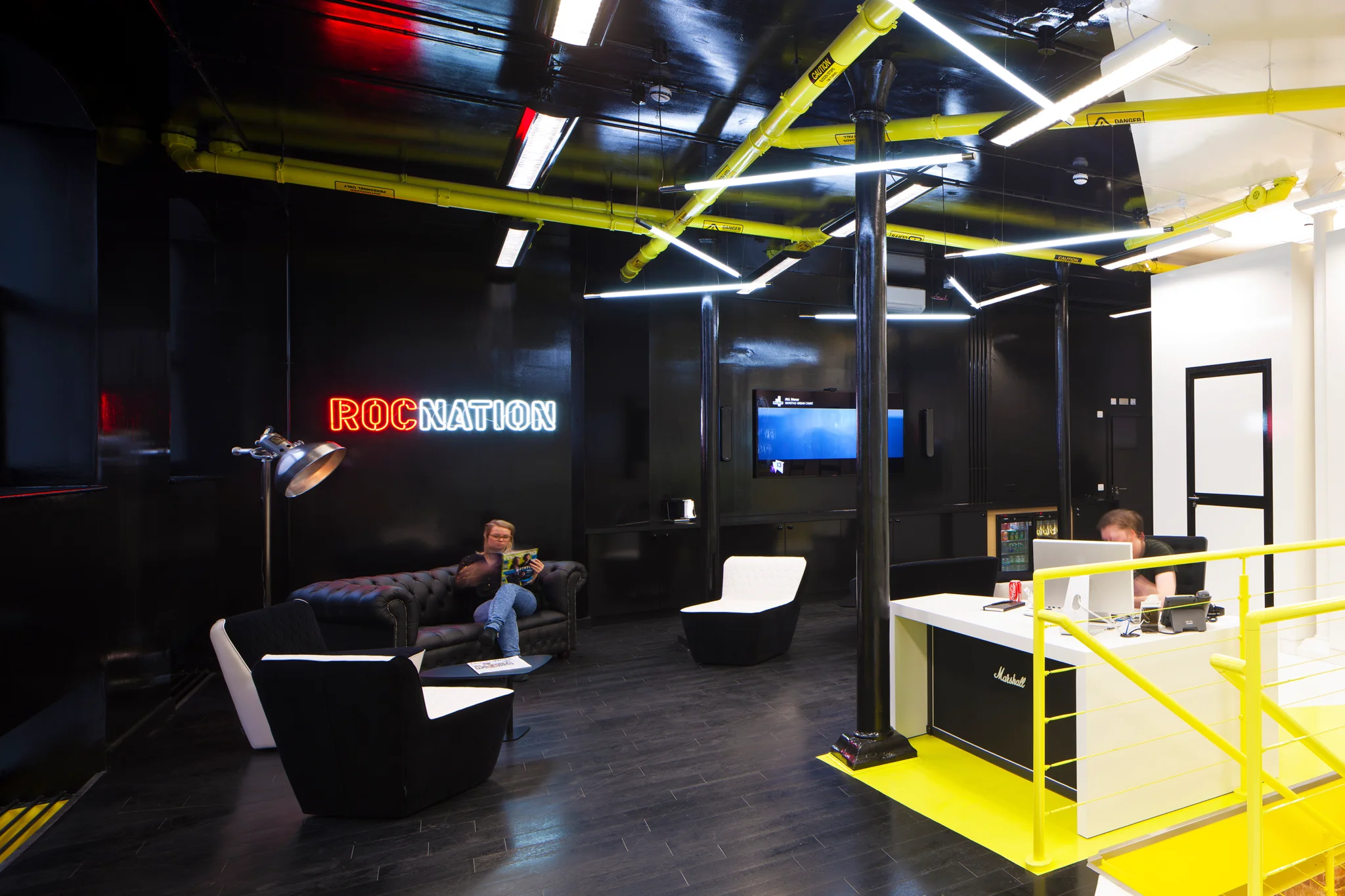roc nation reception area with black, yellow and white colour scheme