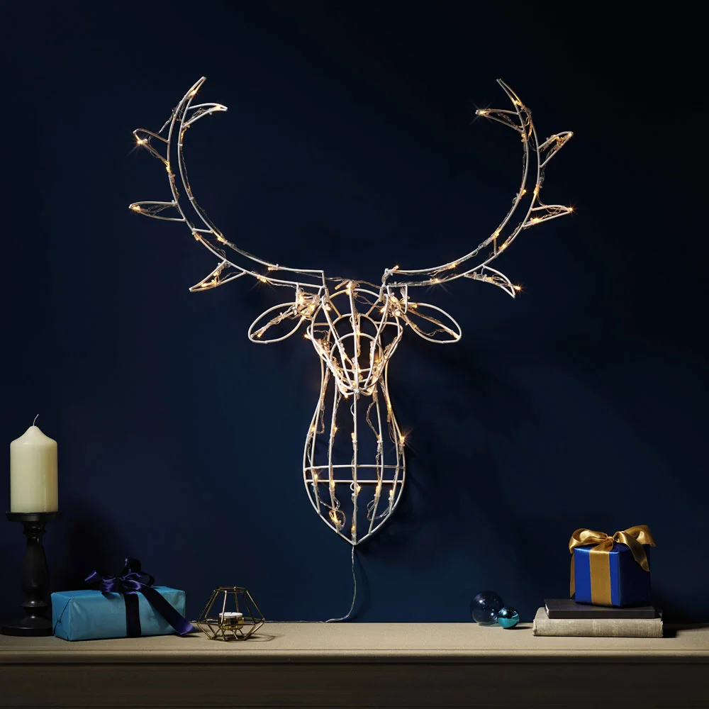 stag head made out of led lights on a black wall