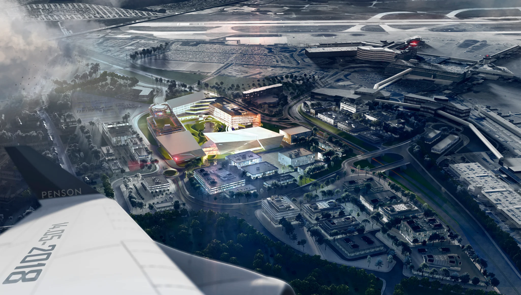 An illuminated aerial view off the wing of a plane of The Hut Group Campus in Manchester