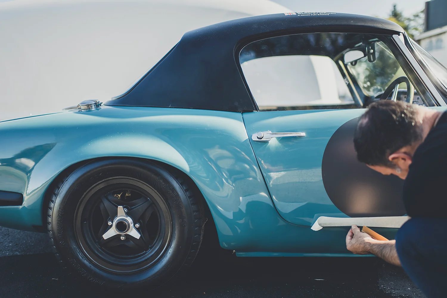 A bright blue Lotus Elan motorcar