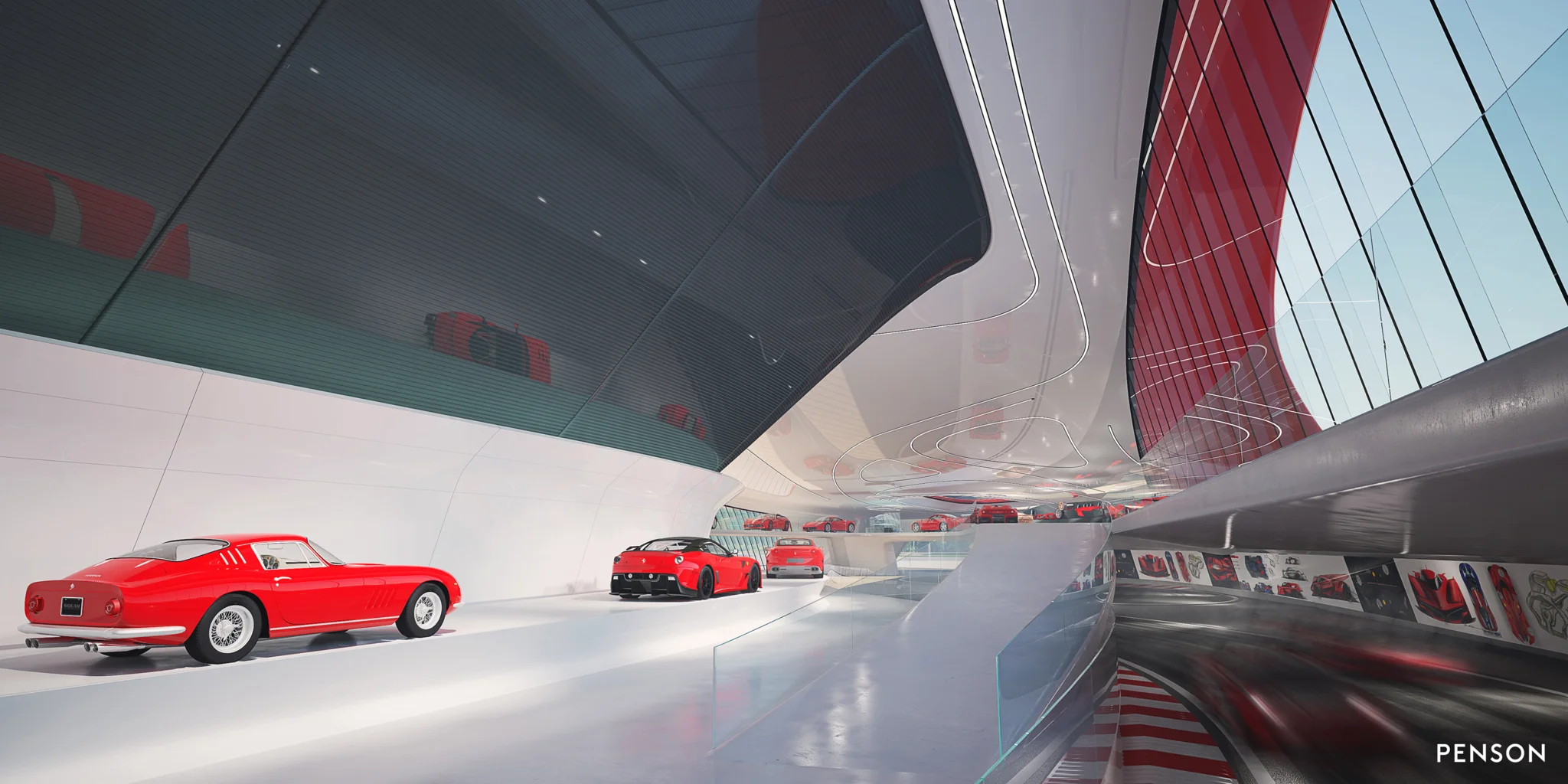 multiple red Ferrari cars in a white enclosed museum space that has a race track to the right hand side