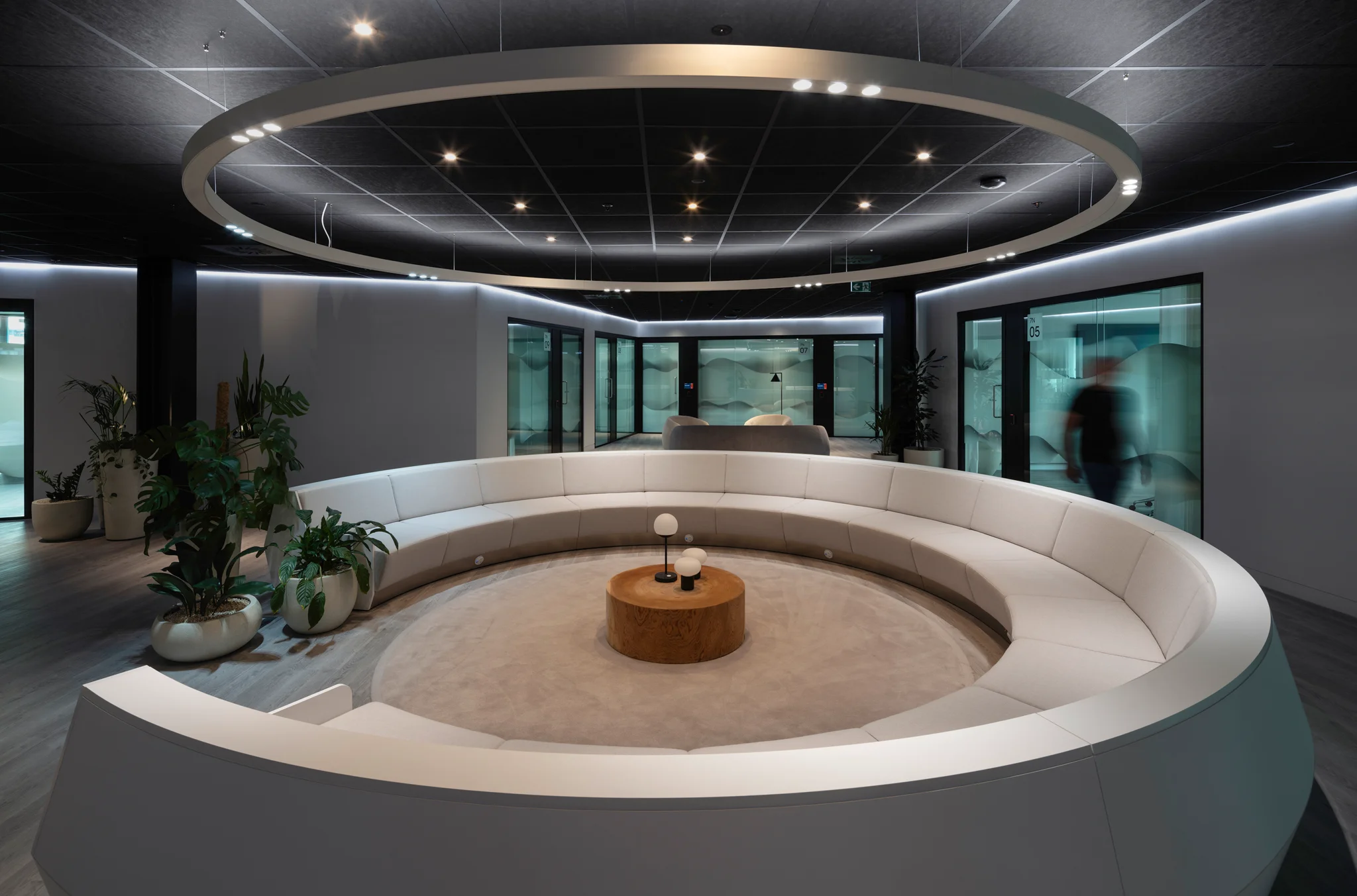 Circular lounge seating beneath a feature ceiling at GSK's London headquarters