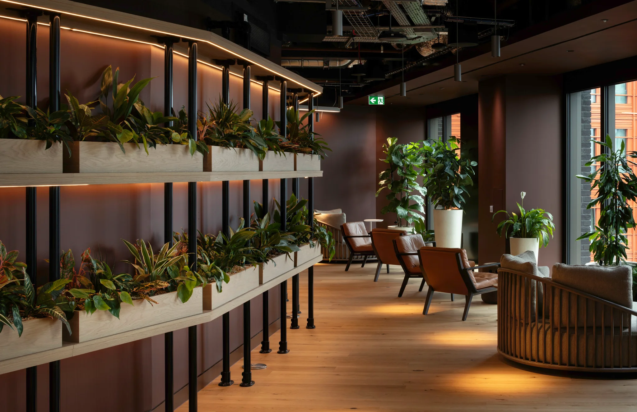 Plant-filled lounge and informal seating area inside GSK's headquarters